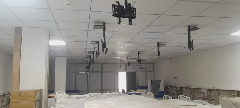 Large hospital hall with grid false ceiling and LED panels
